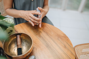 Woman is reading Tarot cards on a table in cafe