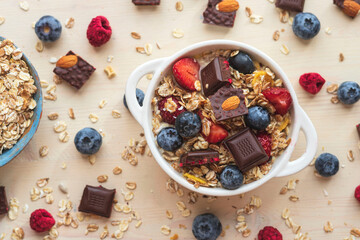 Easy morning breakfast with granola.Muesli from oatmeal, berries view from above