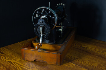 Fototapeta premium gray sewing machine on a black background