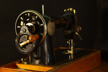 gray sewing machine on a black background