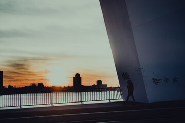 A person walking on Erasmus Bridge, Rotterdam, NL