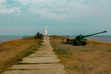 monument to soviet soldiers killed in the second world war and artillery cannon. mourning wreaths...