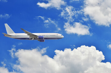 Fototapeta na wymiar Airplane take off on the blue sky and clouds background