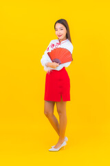 Portrait beautiful young asian woman with red envelopes letter