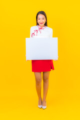 Portrait beautiful young asian woman show white empty billboard