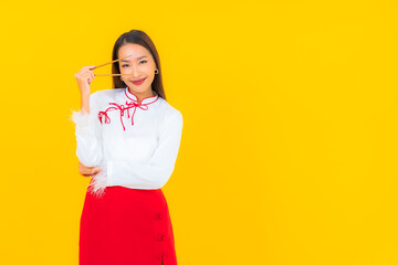 Portrait beautiful young asian woman with chopstick