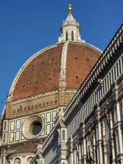 Grand Brunelleschi's Dome close up. It is still the largest masonry cupola in the world. Red-tile dome of famous Florence Cathedral of Saint Mary of the Flower in Piazza del Duomo, Italy, Tuscany.