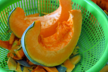 slice the organic pumpkin with a knife, shred the pumpkin for dessert,