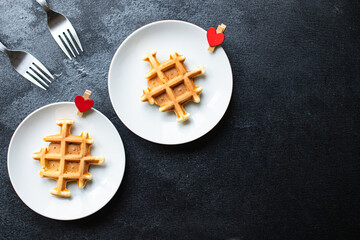 Fototapeta na wymiar Belgian waffles breakfast for two person shape heart love valentines day background mothers day care or 8 March pleasant top view copy space for text food background rustic