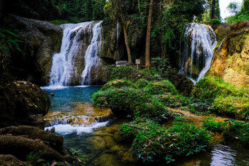 Fototapeta premium Paradise waterfall in deep forest turquoise water