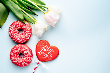 International Women's Day. 8 march number eight consisting of donuts next to tulips and...