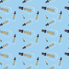 glass light bulb with incandescent filaments. seamless pattern on a blue background.