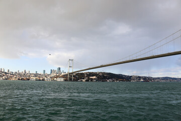 The Bosphorus Bridge,  thus connecting Europe and Asia (alongside Fatih Sultan Mehmet Bridge and Yavuz Sultan Selim Bridge). The bridge extends between Ortaköy (in Europe) and Beylerbeyi (in Asia).