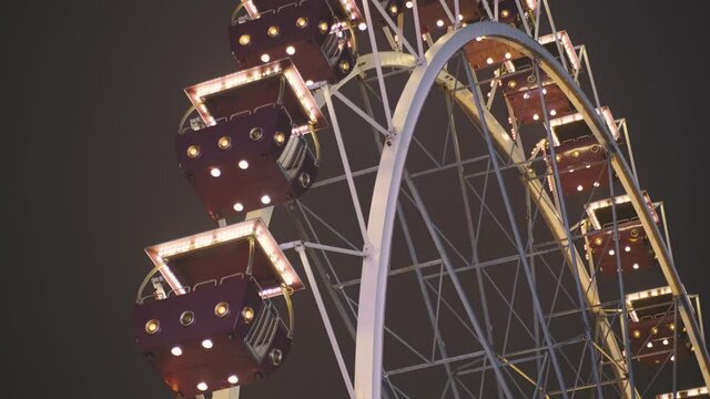 Ferris wheel at night in an amusement park. No people due to quarantine in Odessa amusement park