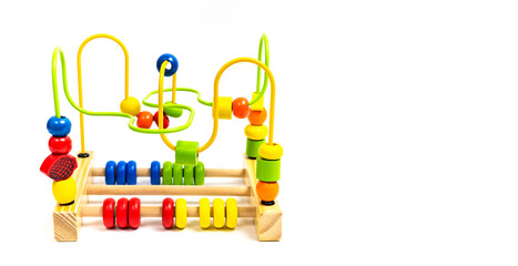 Children's wooden multi-colored toy labyrinth isolated on white background. Toy for baby, the development of fine motor skills of hands, logical thinking. Eco-friendly toy made from natural wood