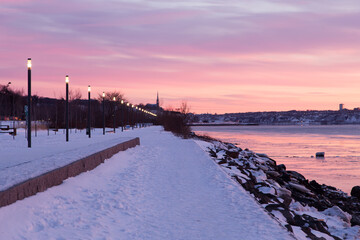 Beautiful Samuel-De Champlain walkway along the St. Lawrence River seen during a colourful winter...