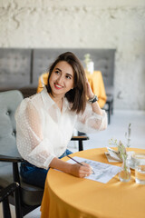business woman sitting in cafe