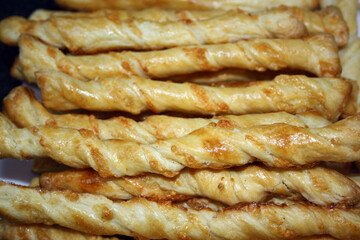Homemade freshly baked breadsticks with cheese.