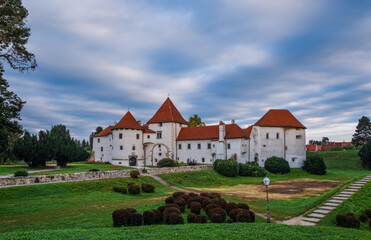 Sunrise at city park and old castle in Varazdin city, Croatia. September cloudy morning, 2020