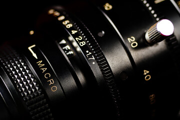 Professional lens on dark background.Lens of vintage camera.