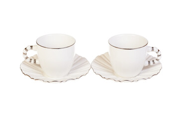 Two white porcelain tea, coffee cups with saucer. Isolated on white