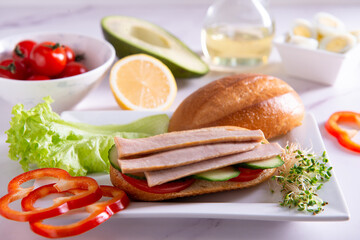 tuna slices with fresh vegetables healthy food on white plate closeup