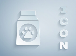 Paper cut Bag of food for dog icon isolated on grey background. Dog or cat paw print. Food for animals. Pet food package. Paper art style. Vector.