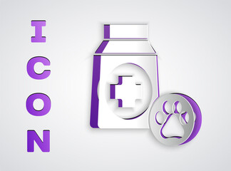 Paper cut Bag of food for dog icon isolated on grey background. Dog or cat paw print. Food for animals. Pet food package. Paper art style. Vector.