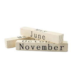 Cube wooden calendar showing month isolated on white background