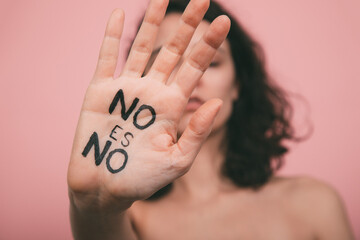 Woman's hand with vindictive painted letters. Feminism concept. No means no concept