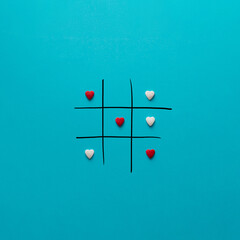 Tic tac toe with red and white hearts. Creative idea.