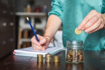 A woman saves money for her future personal projects.
