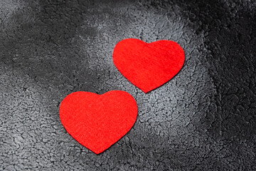 Valentine's day concept. Romantic evening, heart-shaped cut felt, black background,top view.