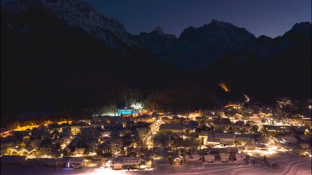 Winter hyperlapse with snow in Kranjska Gora village, Slovenia. Dusk to night panorama.