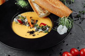 Autumn pumpkin cream soup with dor blue