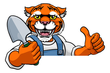 A tiger gardener cartoon gardening animal mascot holding a garden spade tool peeking round a sign and giving a thumbs up