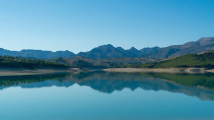 Fototapeta na wymiar View on a beautiful mountain lake in Andalusia in Spain