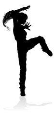 A woman street dance hip hop dancer in silhouette