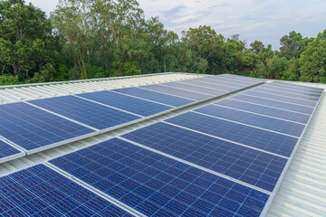 solar cells panel installed on the roof of a large building are full of dirt and dust.