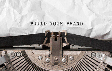 Text Build Your Brand typed on retro typewriter - obrazy, fototapety, plakaty