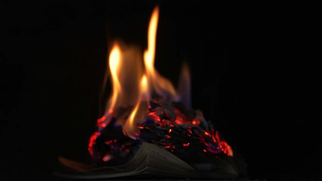 an old notebook burning in the fireplace