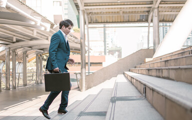 Business man running on steps to work in the morning