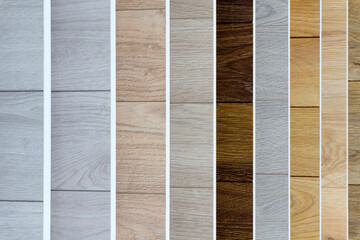 Laminate background. Samples of laminate or parquet with a pattern and wood texture for flooring and interior design. Production of wooden floors..
