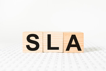 a word SLA on wooden cubes. business concept. business and Finance