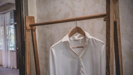 Obraz na płótnie Canvas White Dress Hanging On Clothesline 