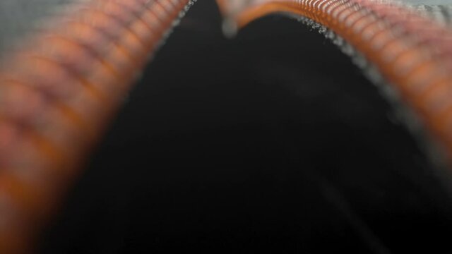 Going through inside the black luggage bag while opening the orange zipper in Estonia