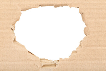 Ripped hole in cardboard on white background