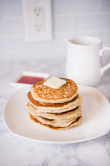 golden brown pancakes with strawberry topping