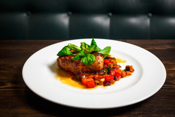 Juicy piece of meat with stewed vegetables