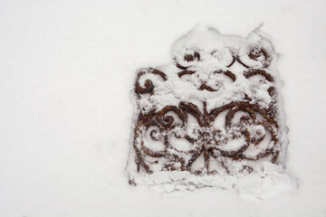 decorative metal grill in the snow
